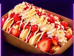 Grayze mini pancakes topped with strawberries, white chocolate and whipped cream